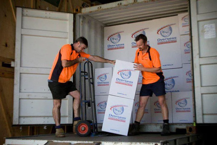 Removalists handling boxes moving from Brisbane