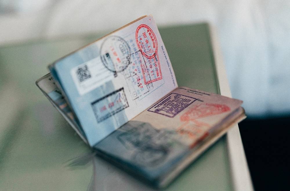 A persons' passport on a table for their move internationally