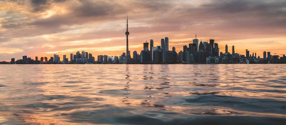 Aussies Moving Overseas withToronto City in the background