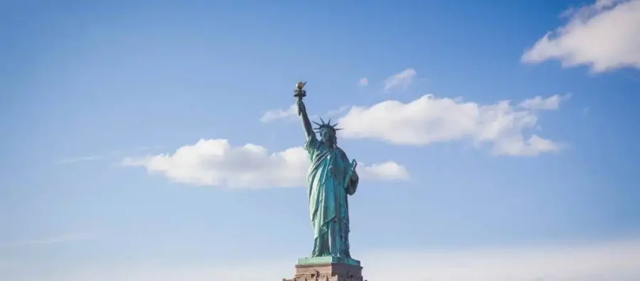 Statue of Liberty is pictured with a blue skye in the background